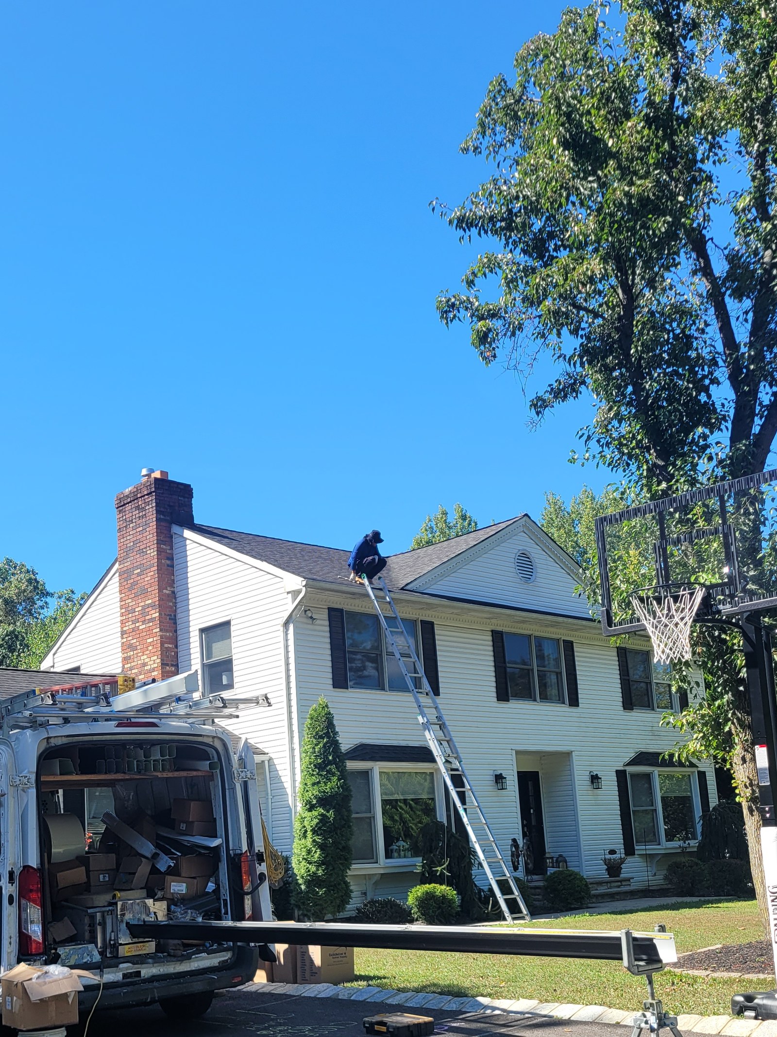 Jersey Strong crew member installing seamless gutter on a New Jersey home